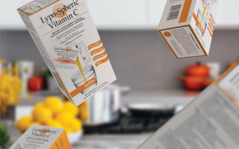 lypo-spheric vitamin c cartons flying through the air in the kitchen