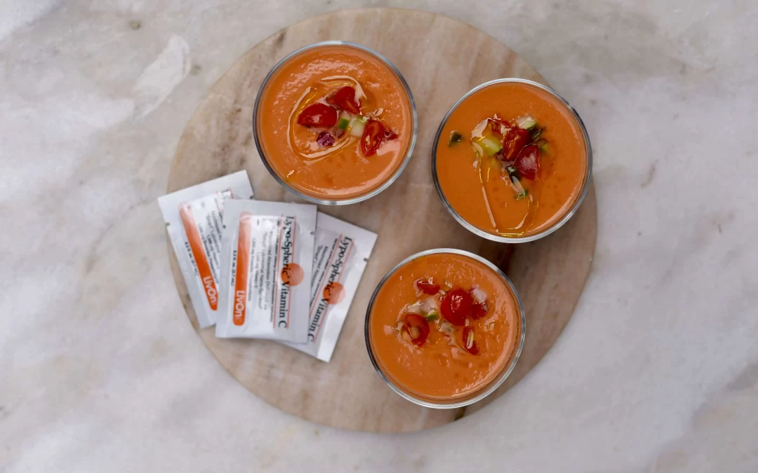 three bowls of gazpacho with packets of lypo-spheric vitamin c